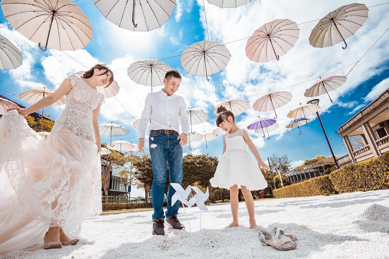 Stancy family under umbrella art installation