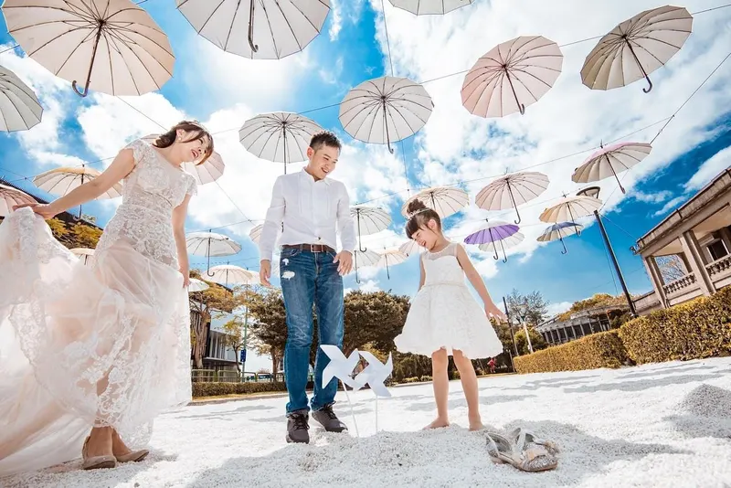Stancy family under umbrella art installation